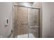 Shower with sliding glass doors and beige tiled walls, complete with safety bars at 6586 Quail Run, Fishers, IN 46038