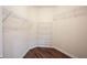 Walk-in closet featuring multiple wire shelving units and wood flooring at 6586 Quail Run, Fishers, IN 46038