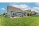 Spacious backyard featuring a hot tub, patio, and well-manicured lawn, and a view of a neighboring home at 6737 Trey Dr, Camby, IN 46113