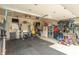 Organized garage featuring exercise equipment, storage solutions, and ample space for parking at 6737 Trey Dr, Camby, IN 46113