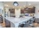 Modern kitchen featuring stainless steel appliances, an island with seating, and stylish pendant lighting at 6737 Trey Dr, Camby, IN 46113