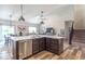 Open kitchen and island providing a seamless flow between the kitchen, dining area, and living room at 6737 Trey Dr, Camby, IN 46113