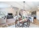 Spacious open-concept living room, dining area, and kitchen create an airy and inviting atmosphere at 6737 Trey Dr, Camby, IN 46113