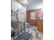 View of the bathroom featuring a toilet, vanity, unique shower curtain, and neutral colored walls at 6805 Jackson St, Indianapolis, IN 46241
