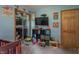 This is a bright bedroom featuring a carpet flooring, closet, and decor at 6805 Jackson St, Indianapolis, IN 46241