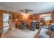 Cozy living room with wood-paneled walls, comfortable seating, and warm, inviting lighting at 6805 Jackson St, Indianapolis, IN 46241