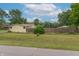 The backyard is fully fenced and showcases the home's large lot with plenty of green space at 6805 Jackson St, Indianapolis, IN 46241