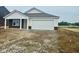 Charming single-story home with a two-car garage, white siding, and dark brown brick accents at 6812 Rawlings Ln, Indianapolis, IN 46221