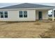 Bright and airy single story home featuring white siding, large windows, and a covered porch at 6812 Rawlings Ln, Indianapolis, IN 46221