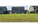 Spacious backyard featuring a patio set and green grass at 7153 Sultans Run Ln, Whitestown, IN 46075