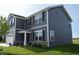 Gorgeous two-story home with a three-car garage and lush green lawn at 7153 Sultans Run Ln, Whitestown, IN 46075