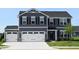 Charming two-story home with a three-car garage and manicured front lawn at 7153 Sultans Run Ln, Whitestown, IN 46075