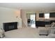 Open concept living room flows into a modern kitchen with granite countertops and stainless steel appliances at 7153 Sultans Run Ln, Whitestown, IN 46075