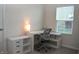 Bright home office with white desk, storage, a comfortable chair, and natural light from a window at 7153 Sultans Run Ln, Whitestown, IN 46075