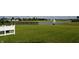 Scenic view of a pond with a fountain and black metal fence at 7153 Sultans Run Ln, Whitestown, IN 46075