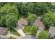 Stunning aerial view of a home with lush greenery, a pond, and well-maintained landscaping at 7175 Scarlet Oak Dr, Noblesville, IN 46062