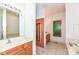 This bathroom has wood vanities, a shower, and a soaking tub at 7175 Scarlet Oak Dr, Noblesville, IN 46062