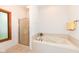 This bathroom offers a shower and separate soaking tub at 7175 Scarlet Oak Dr, Noblesville, IN 46062