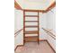 This closet features custom shelving and wooden racks at 7175 Scarlet Oak Dr, Noblesville, IN 46062
