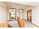 Bright foyer boasts natural light, tile flooring, chandelier, and half bath at 7175 Scarlet Oak Dr, Noblesville, IN 46062
