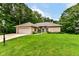 Well-maintained lawn leading to brick home featuring a two-car garage and manicured landscaping at 7175 Scarlet Oak Dr, Noblesville, IN 46062
