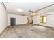 Spacious garage with concrete floor, window, and door to a stairway at 7175 Scarlet Oak Dr, Noblesville, IN 46062