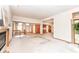Open-concept living room with a fireplace, staircase, and views into the kitchen at 7175 Scarlet Oak Dr, Noblesville, IN 46062
