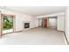 This is a living room with a fireplace and sliding glass door to the outside at 7175 Scarlet Oak Dr, Noblesville, IN 46062