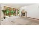 Light-filled living room with sliding glass doors to the balcony and fireplace at 7175 Scarlet Oak Dr, Noblesville, IN 46062