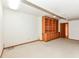 This living room has carpeting and a built-in bookshelf with storage at 7175 Scarlet Oak Dr, Noblesville, IN 46062