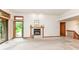 Bright living room featuring a fireplace and sliding glass doors to the outside at 7175 Scarlet Oak Dr, Noblesville, IN 46062