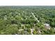 Beautiful aerial view showing a neighborhood with lush landscaping and homes with mature trees at 7629 Candlewood Ln, Indianapolis, IN 46250
