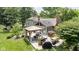A backyard with a gazebo, outdoor furniture, BBQ, dining set, and patio offer an entertaining space at 7629 Candlewood Ln, Indianapolis, IN 46250