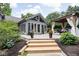 Charming backyard featuring enclosed patio, gazebo and surrounding greenery at 7629 Candlewood Ln, Indianapolis, IN 46250