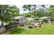 A spacious backyard with a deck, patio, gazebo, and manicured lawn complements this home's appeal at 7629 Candlewood Ln, Indianapolis, IN 46250