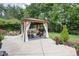 Backyard featuring a gazebo with curtains and an outdoor dining area, ideal for entertaining and relaxation at 7629 Candlewood Ln, Indianapolis, IN 46250