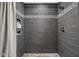 Modern bathroom featuring tiled shower with built in storage at 7629 Candlewood Ln, Indianapolis, IN 46250