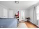 Bright bedroom featuring hardwood floors, closet and ensuite access at 7629 Candlewood Ln, Indianapolis, IN 46250