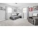 Comfortable bedroom space with plush seating and abundant natural light at 7629 Candlewood Ln, Indianapolis, IN 46250