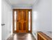 Beautiful foyer with hardwood floors and a decorative wood door at 7629 Candlewood Ln, Indianapolis, IN 46250