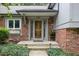 The beautiful front porch has a decorative glass door and a window box at 7629 Candlewood Ln, Indianapolis, IN 46250