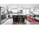 Spacious kitchen with modern appliances, large island, and breakfast nook at 7629 Candlewood Ln, Indianapolis, IN 46250