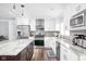 Updated kitchen featuring stainless steel appliances and ample counter space at 7629 Candlewood Ln, Indianapolis, IN 46250