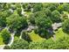 Lush, green neighborhood with home in large wooded lot at 7736 Wawasee Dr, Indianapolis, IN 46250