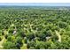 Wide aerial shot of neighborhood covered in mature trees at 7736 Wawasee Dr, Indianapolis, IN 46250
