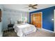 Bright bedroom with plush carpeting, ceiling fan, and well-lit with natural light at 7736 Wawasee Dr, Indianapolis, IN 46250