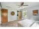 Neutral bedroom with ceiling fan, neutral carpeting, two large closets, and natural light at 7736 Wawasee Dr, Indianapolis, IN 46250