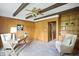 Stylized room with wood panels, ceiling beams, and built in bookshelf at 7736 Wawasee Dr, Indianapolis, IN 46250