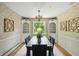 Traditional dining room features a dark wood table, wooden decorations, and natural light at 7736 Wawasee Dr, Indianapolis, IN 46250