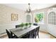 Traditional dining room features a dark wood table, built-in cabinets, and natural light at 7736 Wawasee Dr, Indianapolis, IN 46250